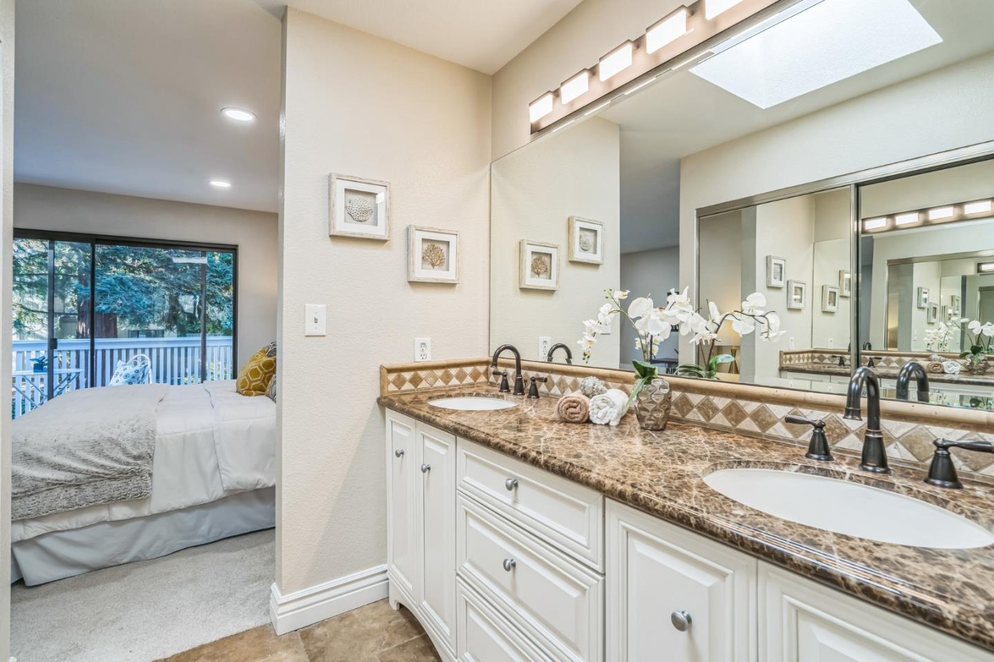 5348 Brookside Court Pleasanton, CA 94588 - Photo 20 of 30 a en suite bathroom with a granite countertop sink and a large mirror