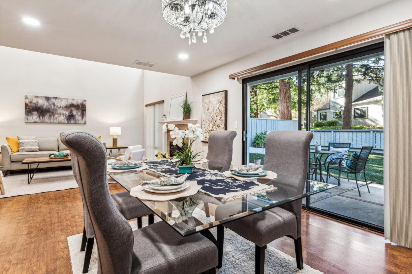5348 Brookside Court Pleasanton, CA 94588 - Photo 5 of 30 a dining room with furniture a chandelier and wooden floor