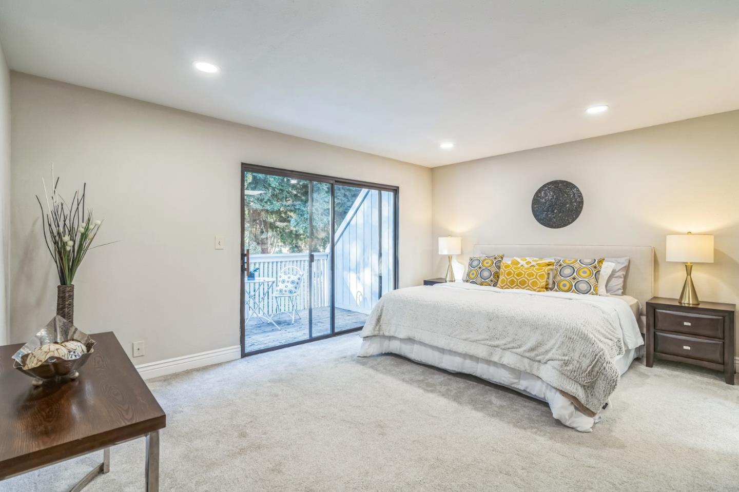 5348 Brookside Court Pleasanton, CA 94588 - Photo 10 of 30 a bedroom with a large bed and a potted plant