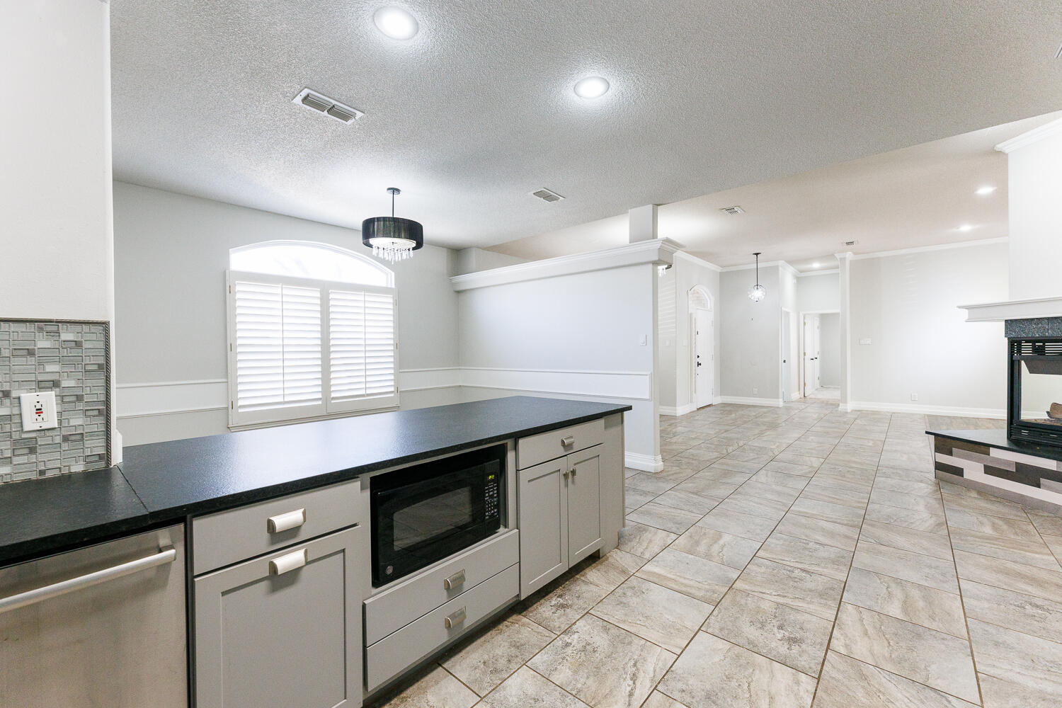 4503 108th Street Lubbock, TX 79424 - Photo 15 of 53 a kitchen with stainless steel appliances granite countertop a stove a sink and a refrigerator