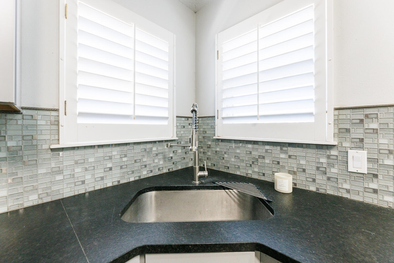4503 108th Street Lubbock, TX 79424 - Photo 16 of 53 a bathroom with a sink a bathtub and window