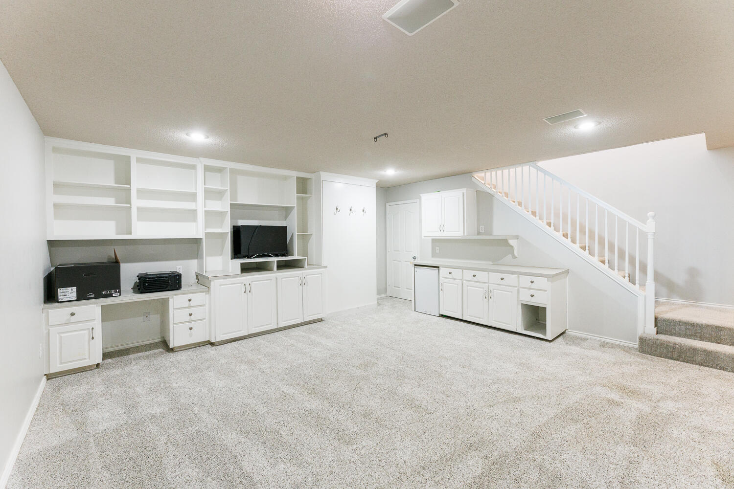 4503 108th Street Lubbock, TX 79424 - Photo 23 of 53 a living room with furniture and a flat screen tv