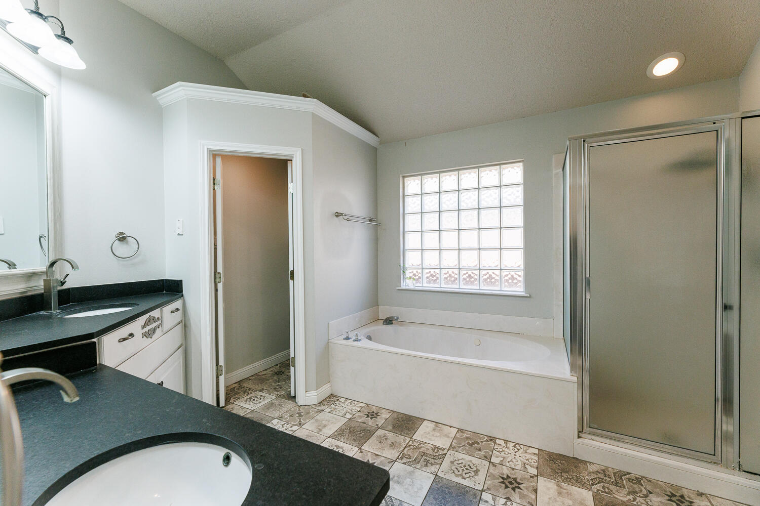 4503 108th Street Lubbock, TX 79424 - Photo 30 of 53 a bathroom with a granite countertop sink toilet and shower