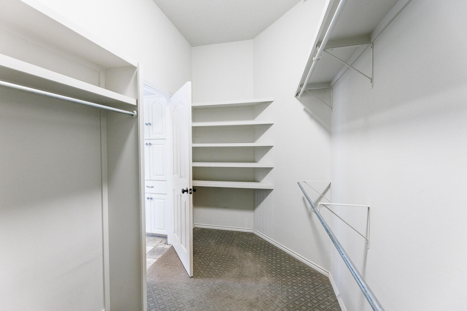 4503 108th Street Lubbock, TX 79424 - Photo 33 of 53 a view of walk in closet with empty racks