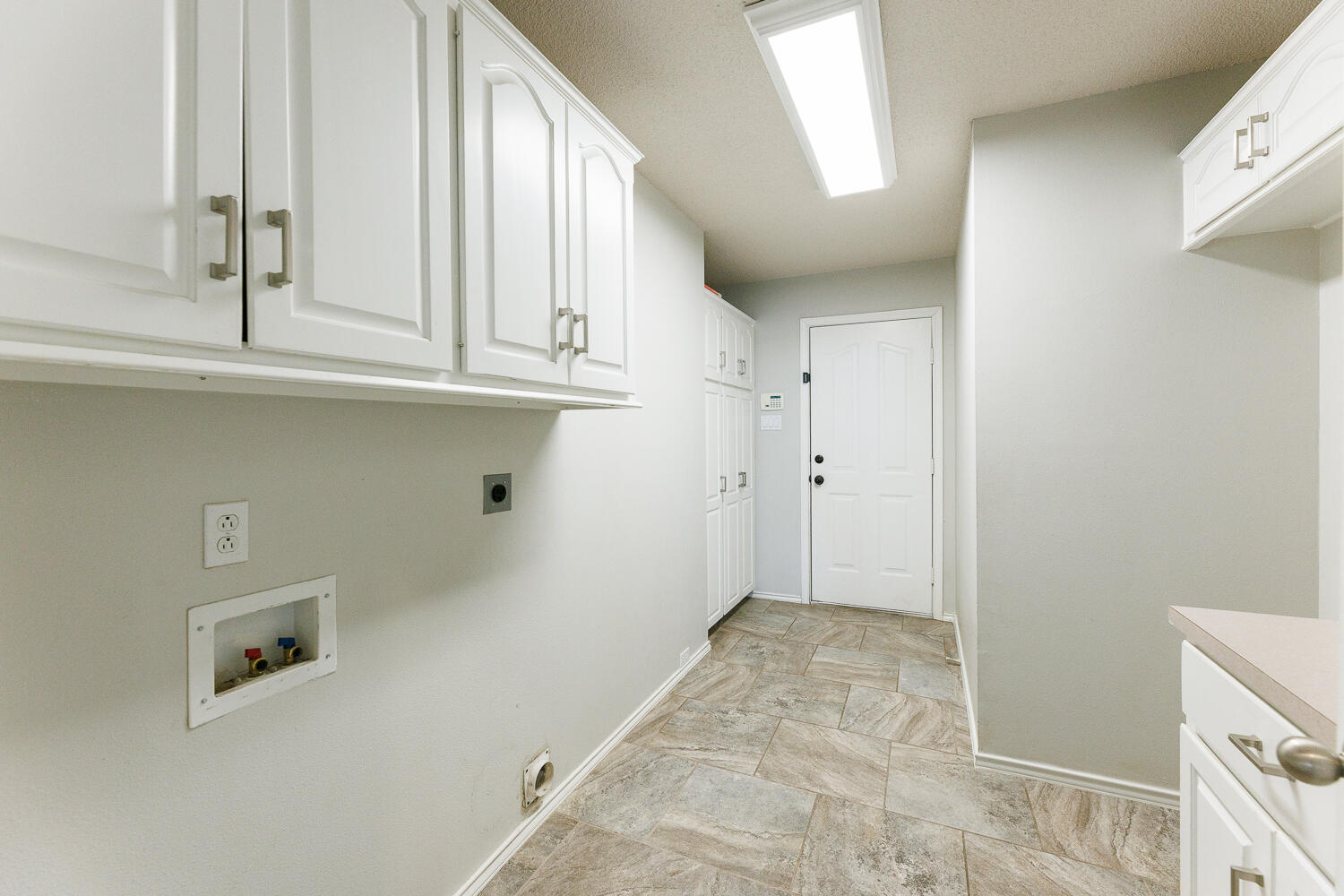 4503 108th Street Lubbock, TX 79424 - Photo 42 of 53 a view of storage and utility room with a sink