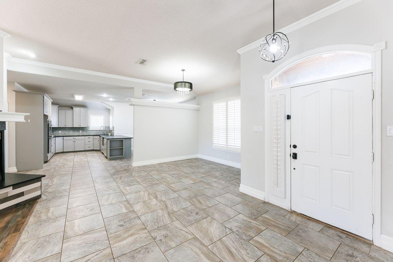 4503 108th Street Lubbock, TX 79424 - Photo 5 of 53 a view of a kitchen with a sink and a refrigerator