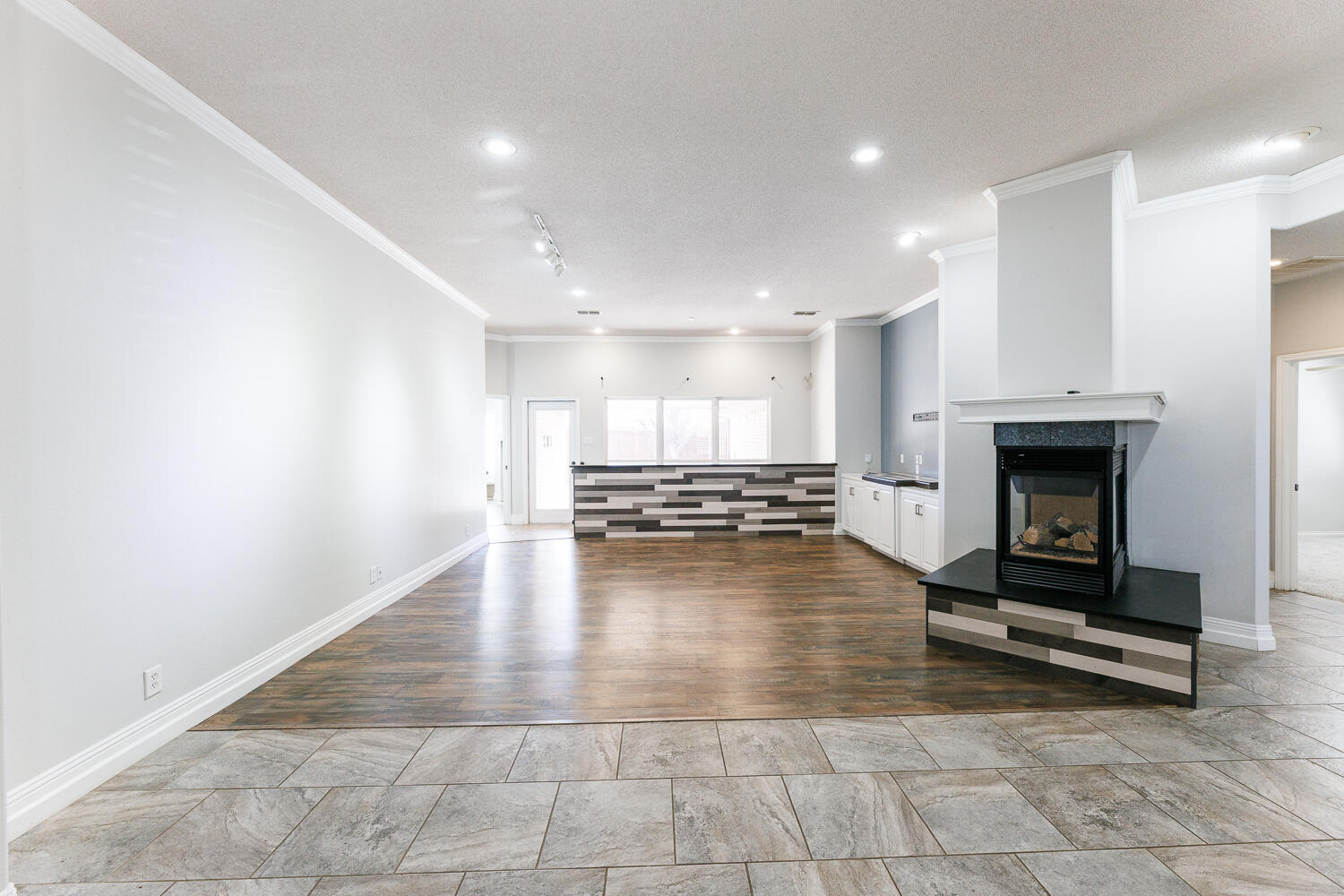 4503 108th Street Lubbock, TX 79424 - Photo 7 of 53 a view of a livingroom with a fireplace