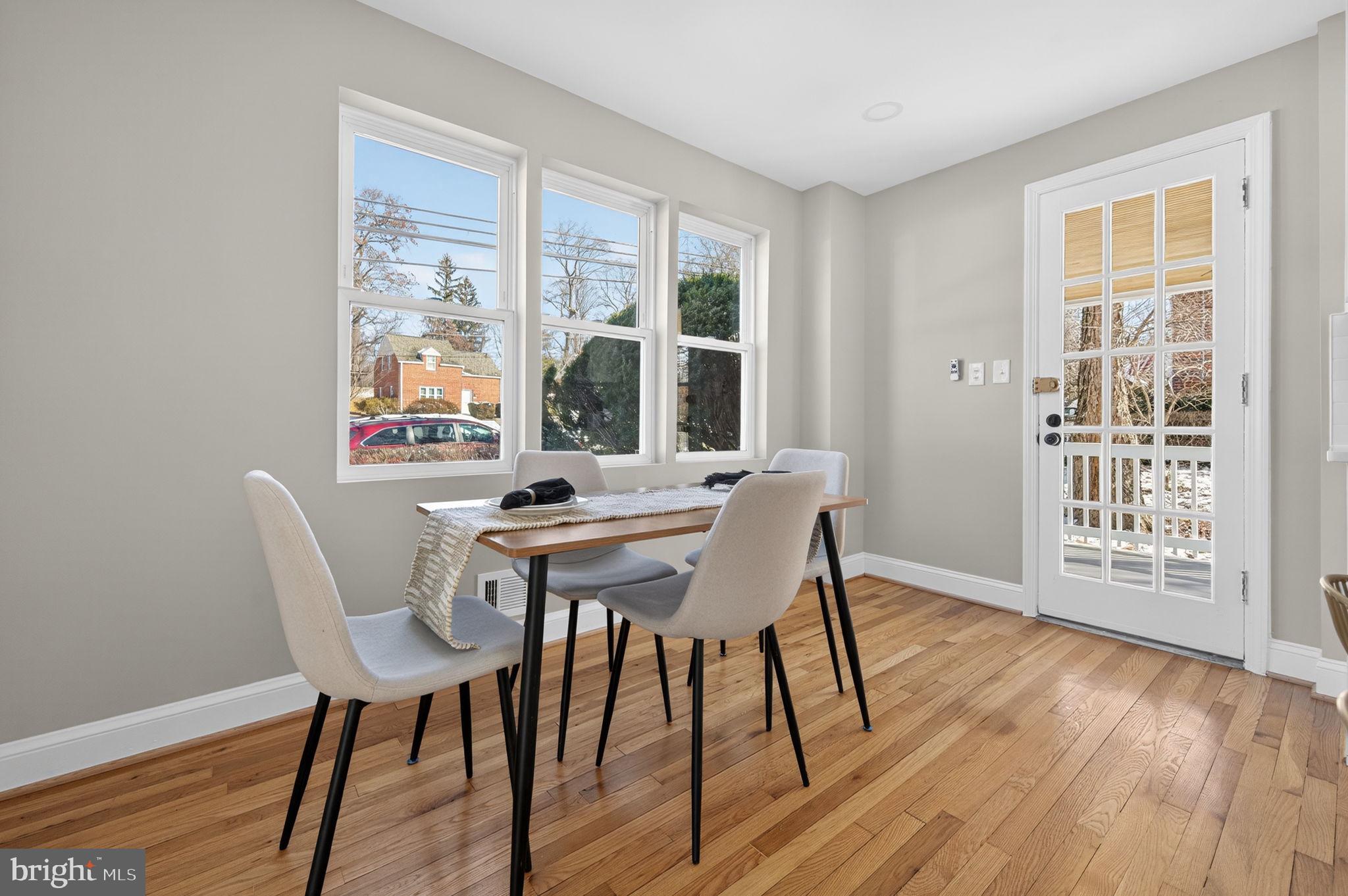914 Dennis Avenue Silver Spring, MD 20901 - Photo 11 of 37 a view of a dining room with furniture and wooden floor