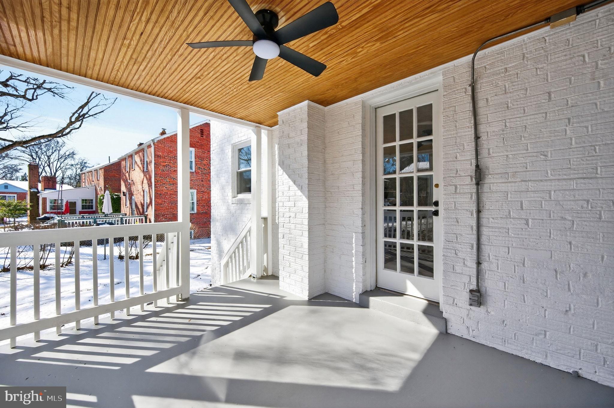 914 Dennis Avenue Silver Spring, MD 20901 - Photo 13 of 37 a view of a porch with a table and chairs