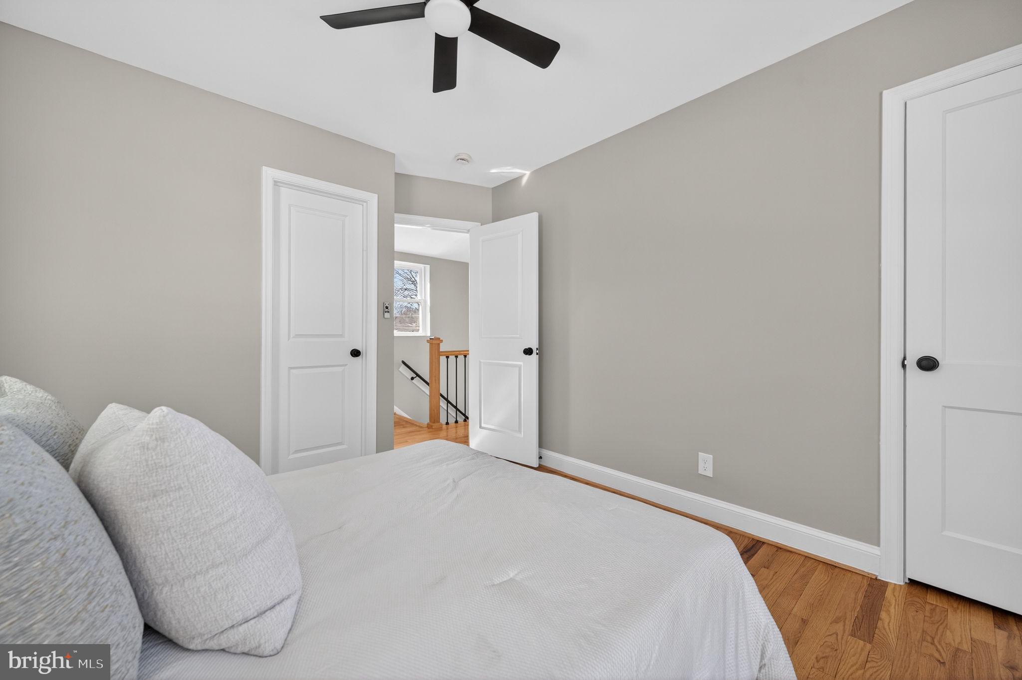 914 Dennis Avenue Silver Spring, MD 20901 - Photo 19 of 37 a bedroom with a bed and a chandelier