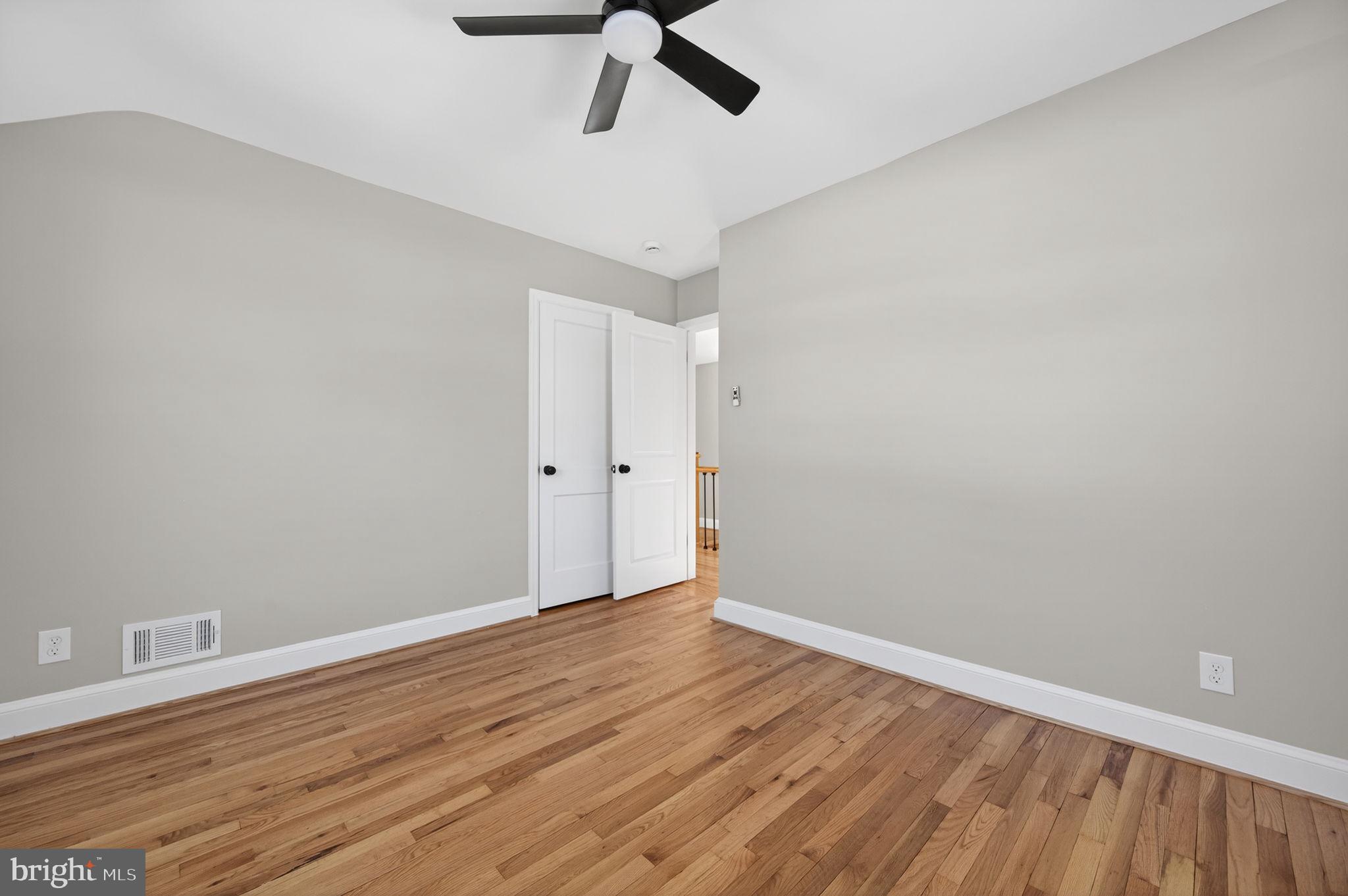 914 Dennis Avenue Silver Spring, MD 20901 - Photo 20 of 37 a view of an empty room with wooden floor