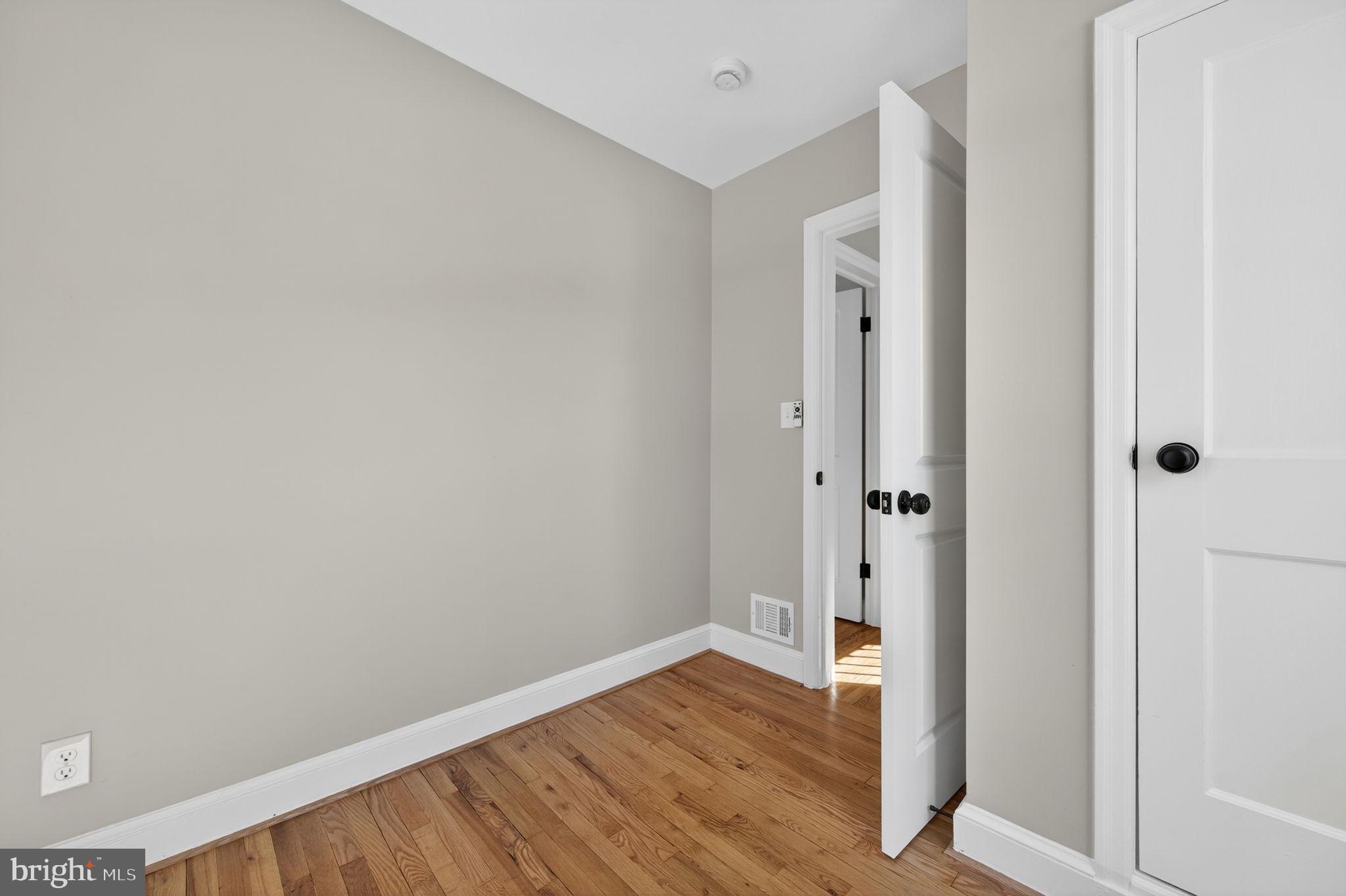 914 Dennis Avenue Silver Spring, MD 20901 - Photo 25 of 37 a view of an empty room with wooden floor