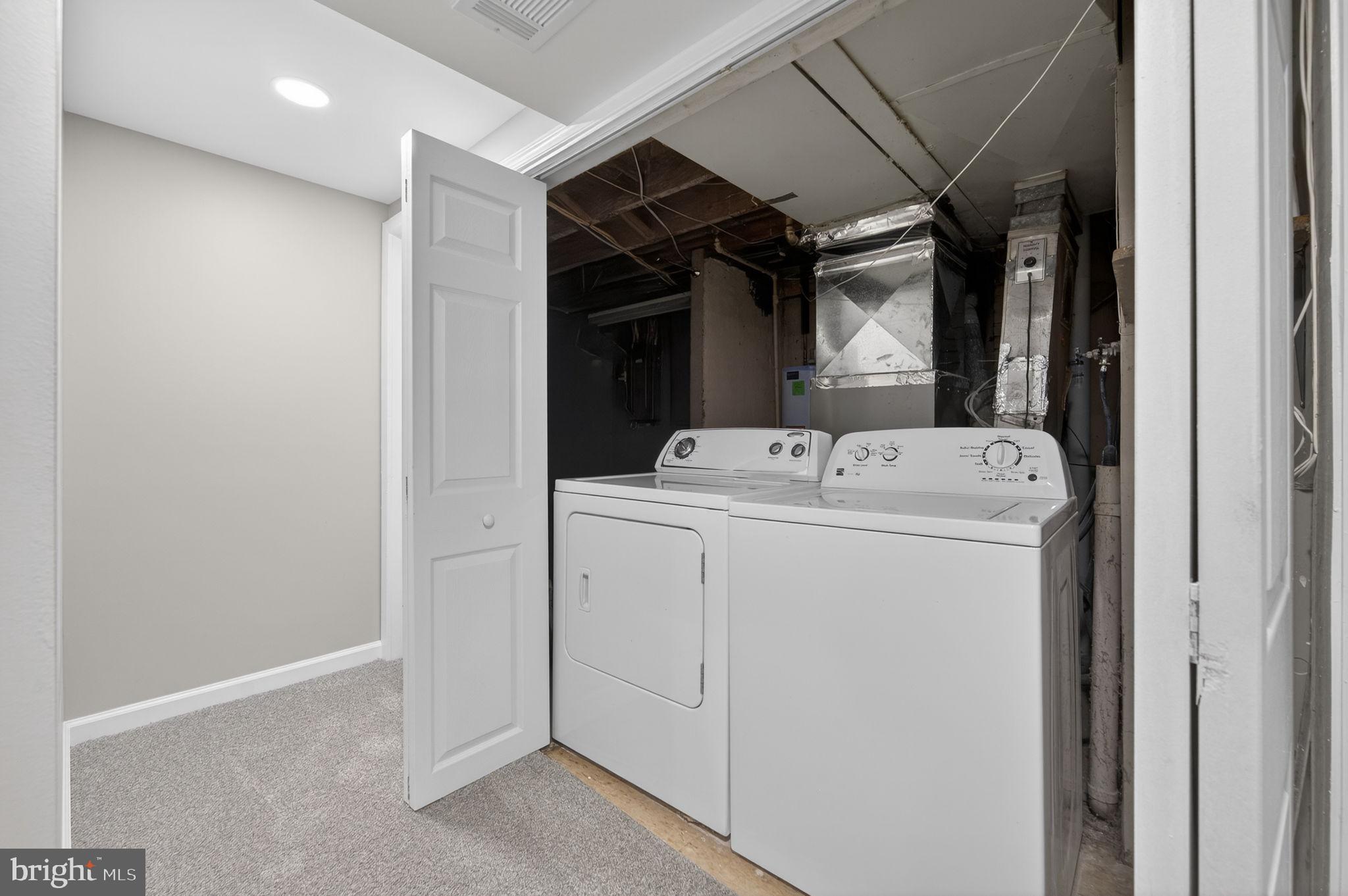 914 Dennis Avenue Silver Spring, MD 20901 - Photo 32 of 37 a utility room with dryer and washer