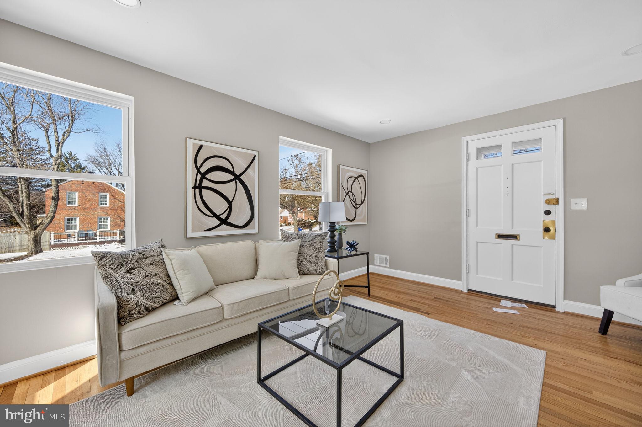 914 Dennis Avenue Silver Spring, MD 20901 - Photo 7 of 37 a living room with furniture and a wooden floor