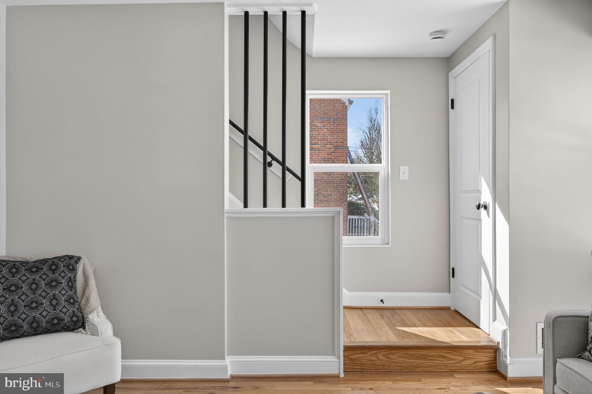 914 Dennis Avenue Silver Spring, MD 20901 - Photo 8 of 37 a view of an entryway with wooden floor and door