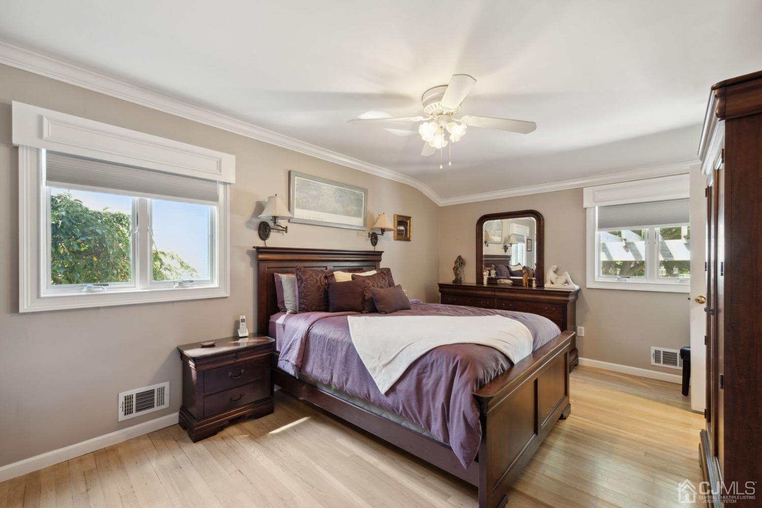 23 Kings Road East Brunswick, NJ 08816 - Photo 22 of 45 a bedroom with a large bed and a window