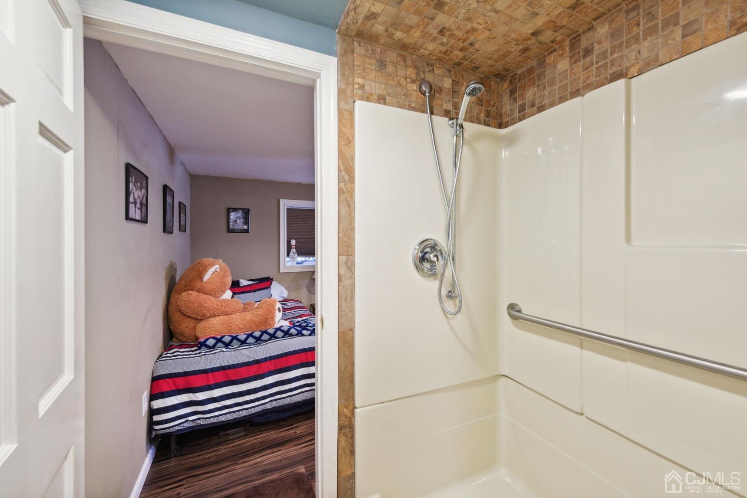 23 Kings Road East Brunswick, NJ 08816 - Photo 33 of 45 a bathroom with a shower and toilet