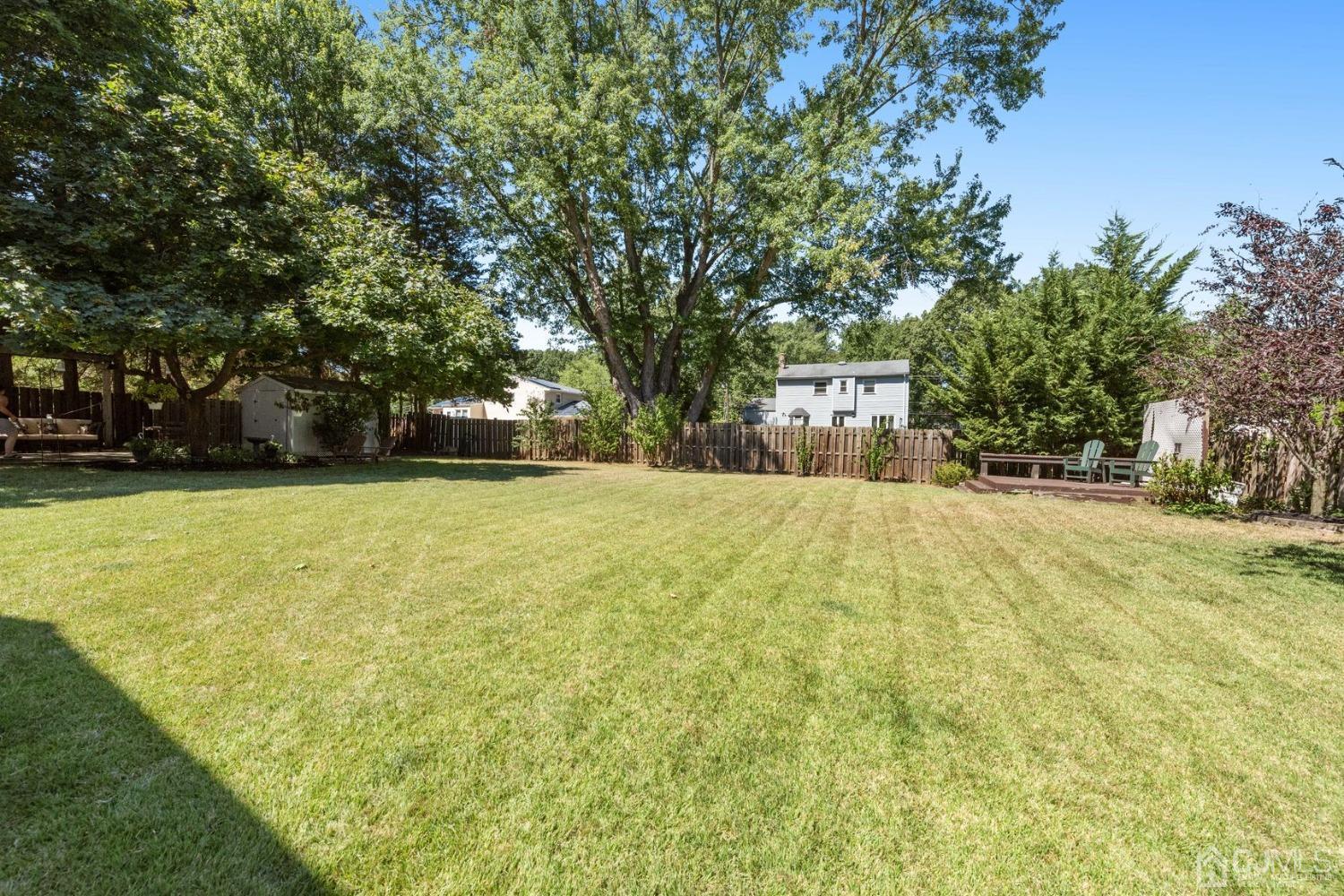 23 Kings Road East Brunswick, NJ 08816 - Photo 41 of 45 a view of swimming pool with large trees and large trees