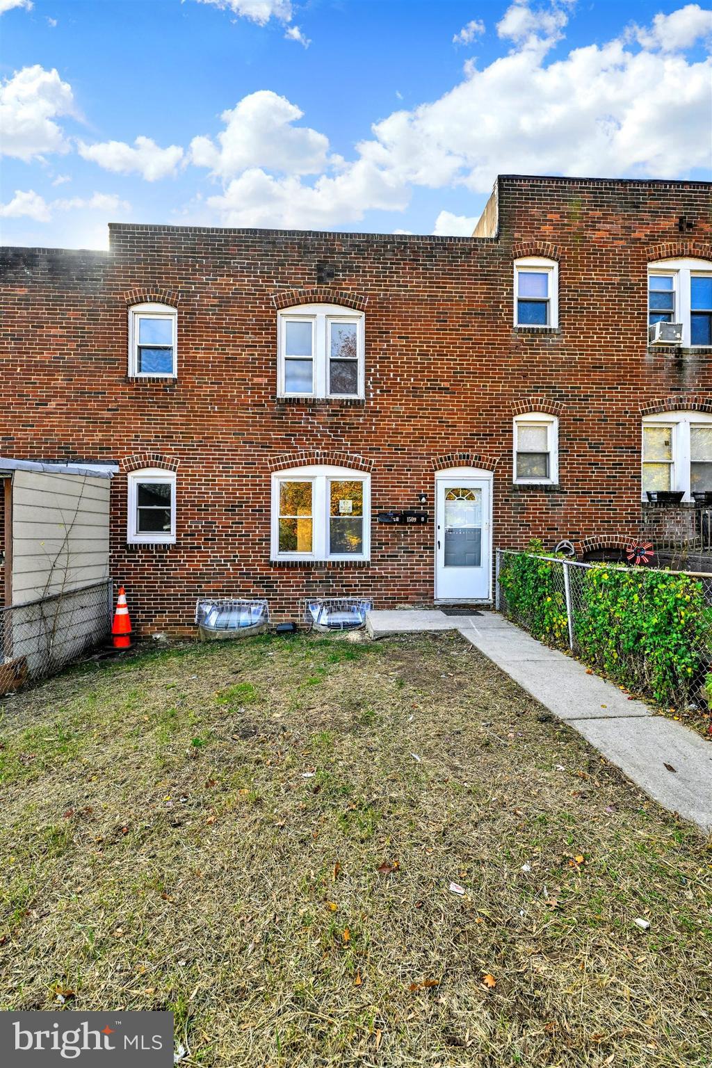 1509 Filbert Street Curtis Bay, MD 21226 - Photo 2 of 28 a view of a brick house with a yard