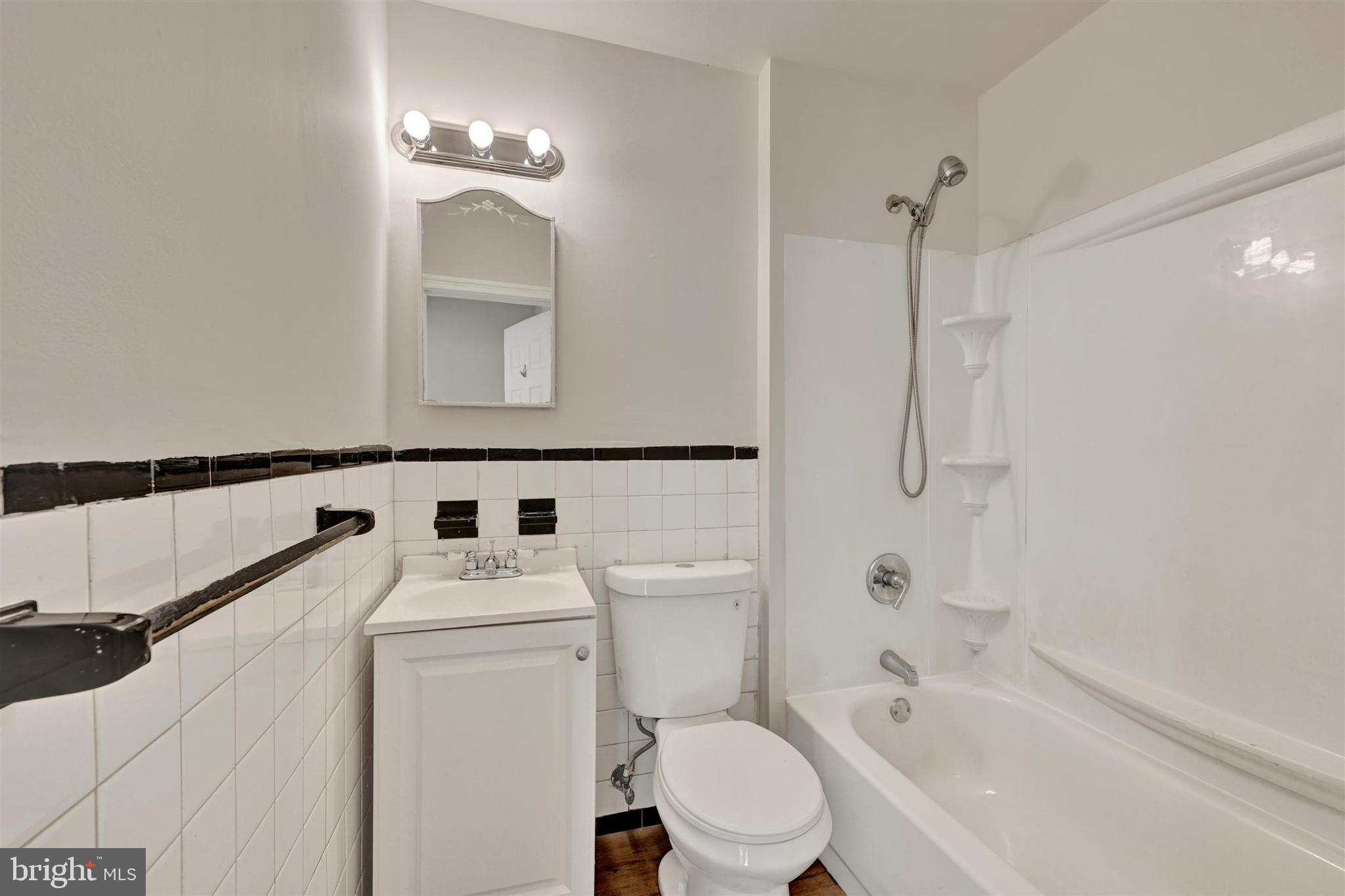 1509 Filbert Street Curtis Bay, MD 21226 - Photo 22 of 28 a bathroom with a sink a toilet and shower