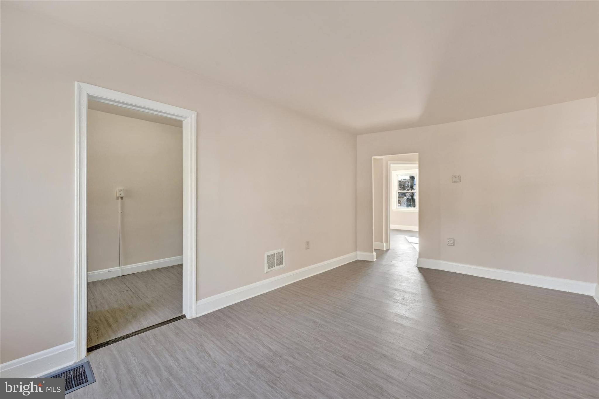 1509 Filbert Street Curtis Bay, MD 21226 - Photo 8 of 28 an empty room with wooden floor & closet area