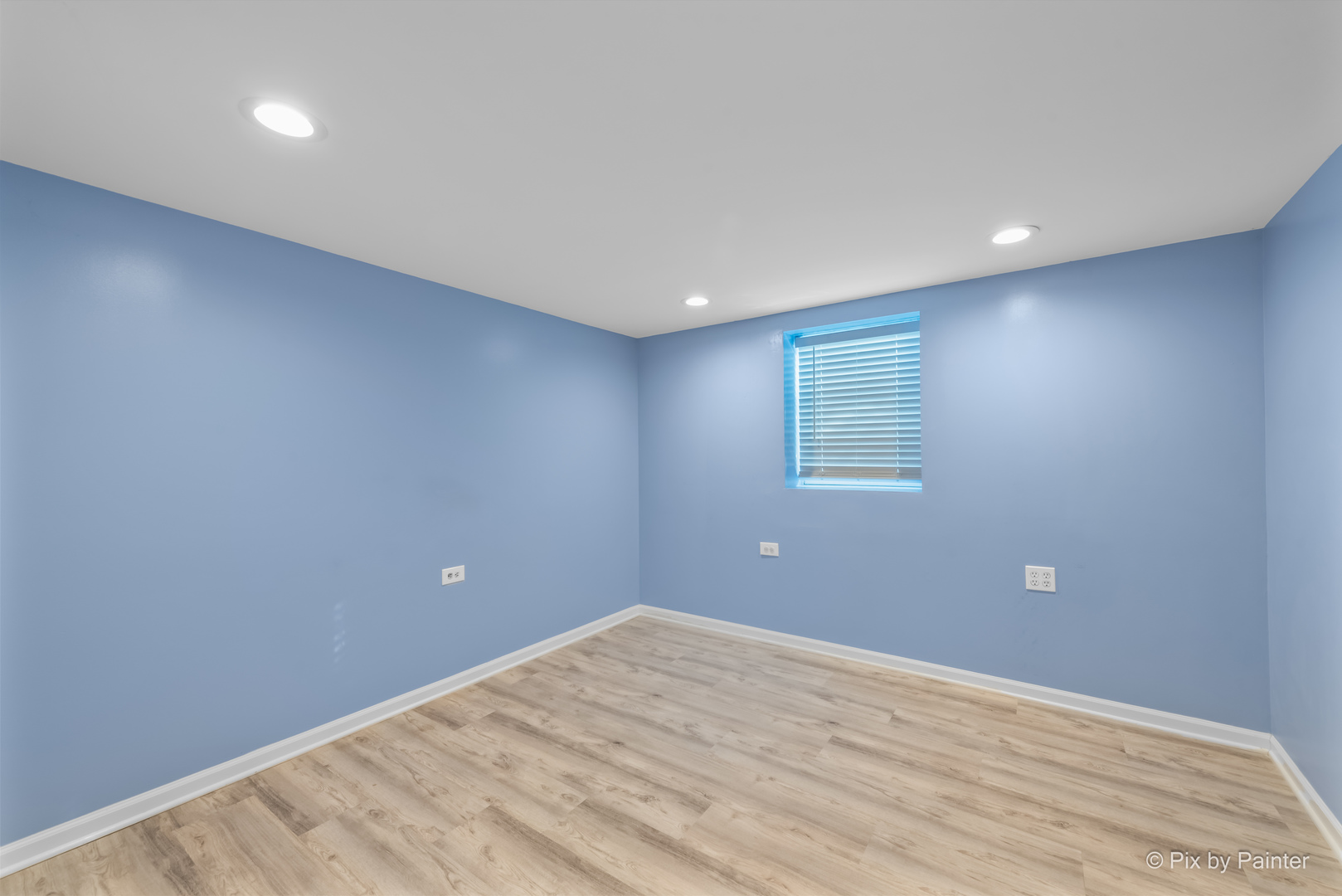 909 Oakton Street Park Ridge, IL 60068 - Photo 11 of 18 a view of a big room with wooden floor and windows