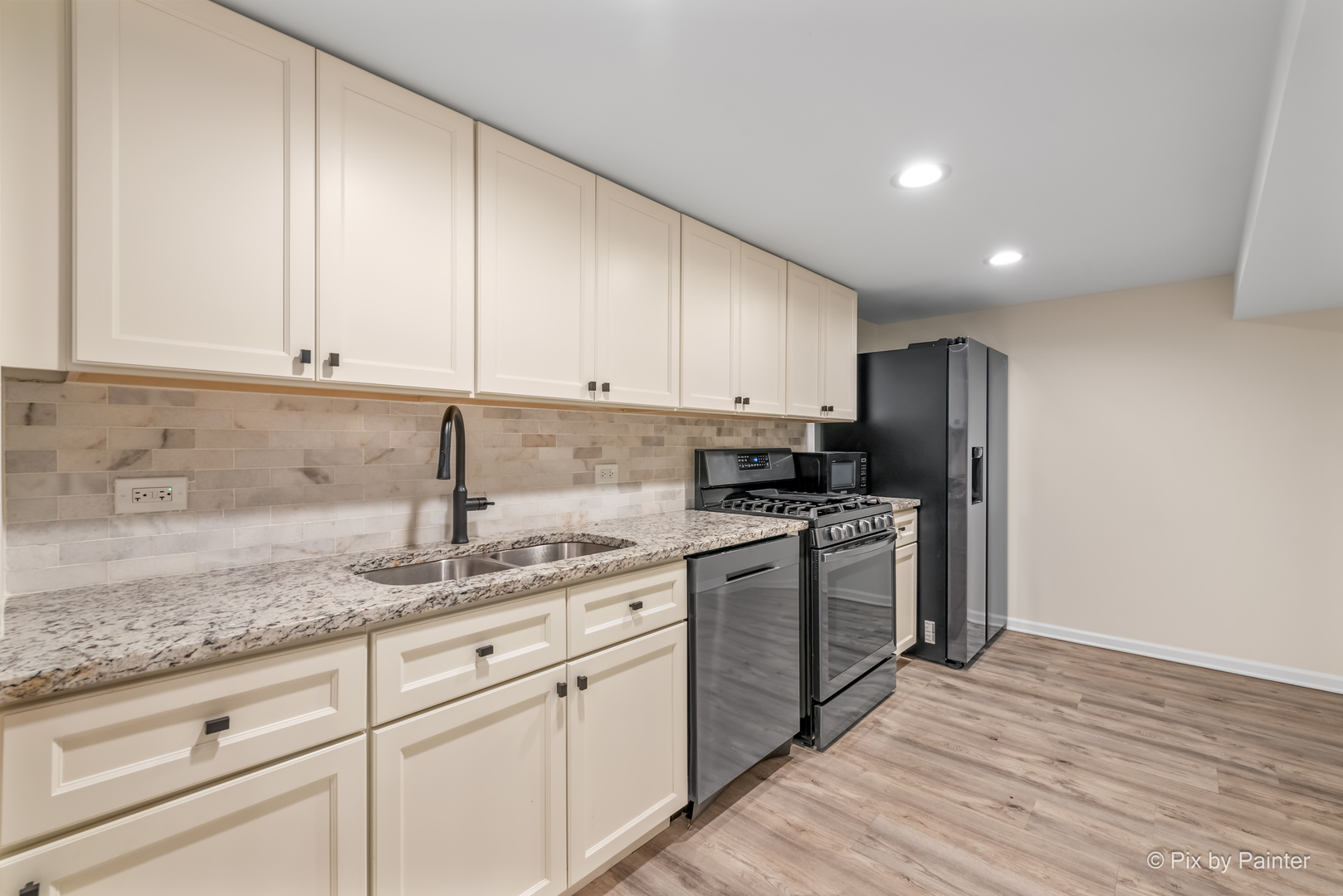 909 Oakton Street Park Ridge, IL 60068 - Photo 14 of 18 a kitchen with stainless steel appliances granite countertop a sink stove and refrigerator