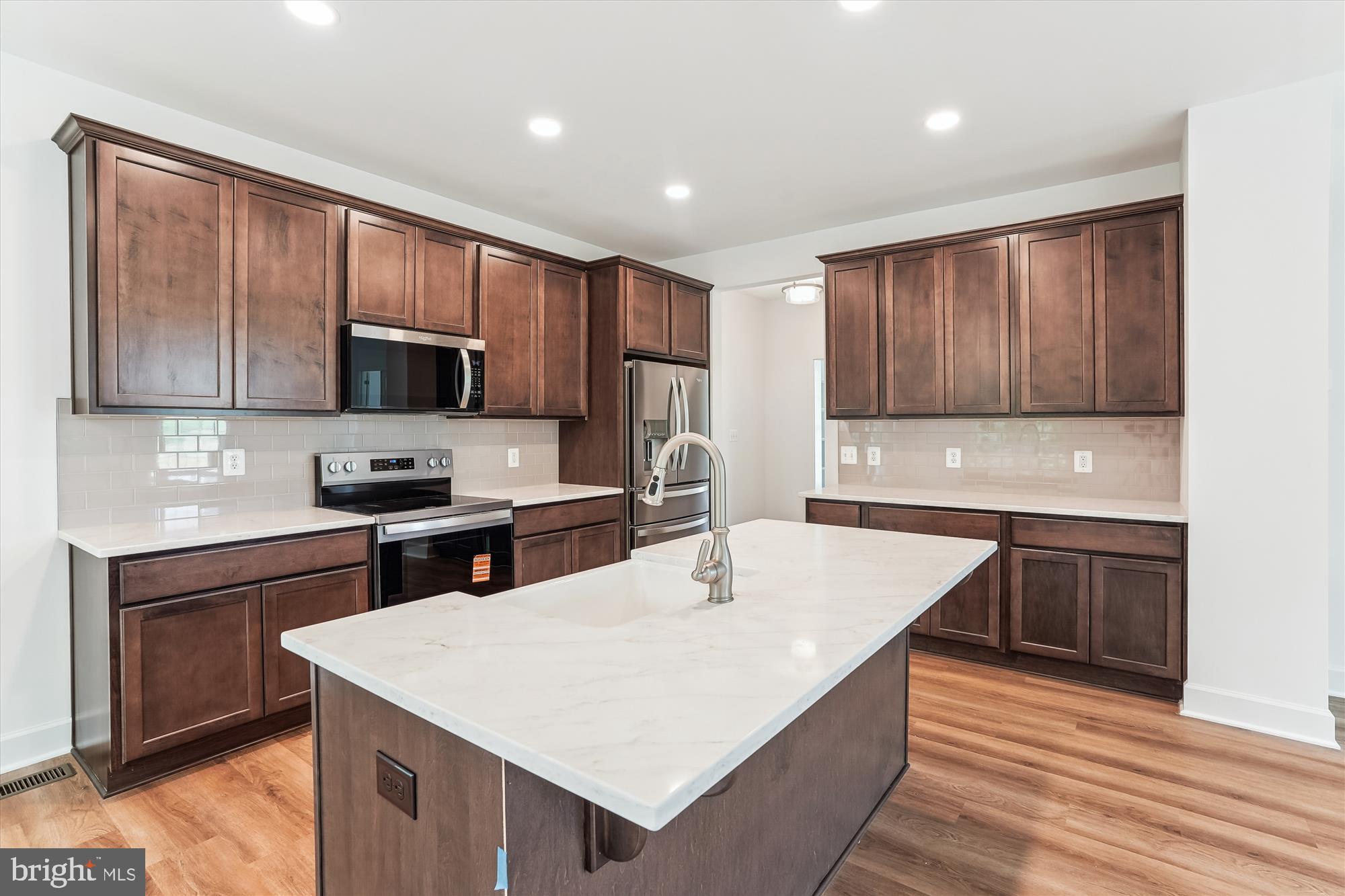 6 Ryland Chapel Road Rixeyville, VA 22737 - Photo 12 of 65 a kitchen with stainless steel appliances granite countertop a sink microwave and cabinets