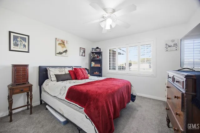 a bedroom with a bed and a table