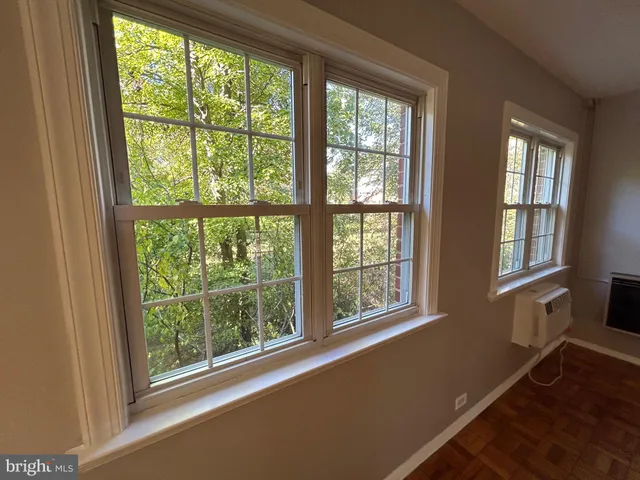 a view of a room with a large window