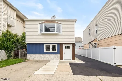 a view of a house with a street