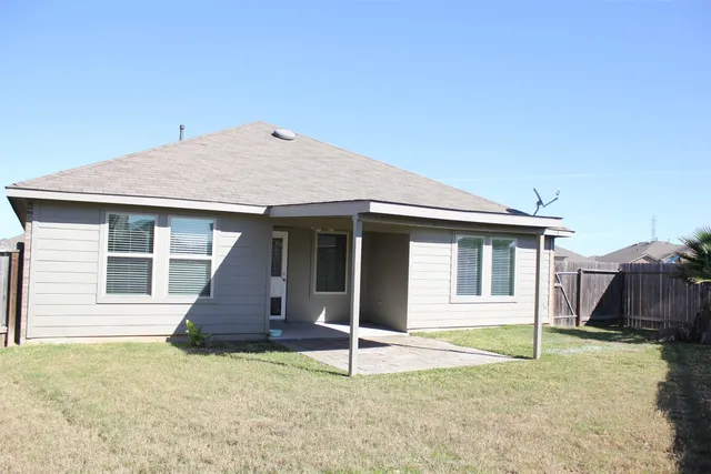 a house with yard in front of it