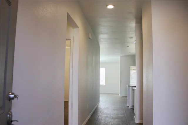 a view of a bathroom from the hallway
