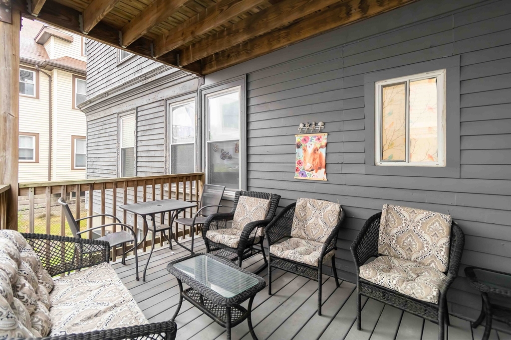 10 Beach Road, Unit 1 Winthrop, MA 02152 - Photo 16 of 19 a balcony with furniture and windows