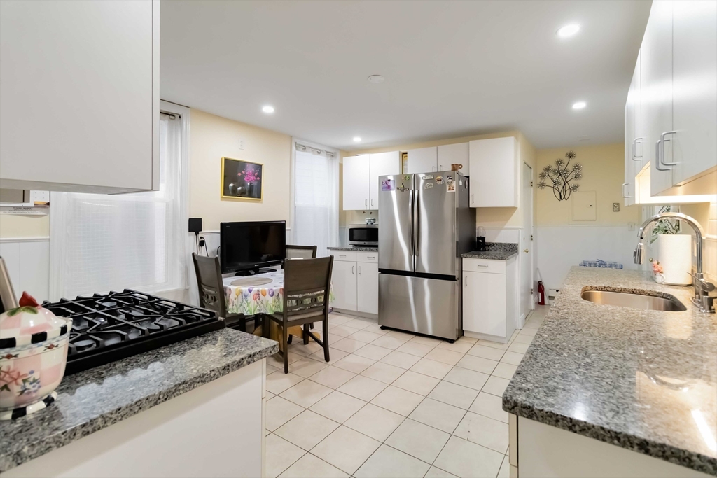 10 Beach Road, Unit 1 Winthrop, MA 02152 - Photo 7 of 19 a kitchen with a refrigerator and a sink