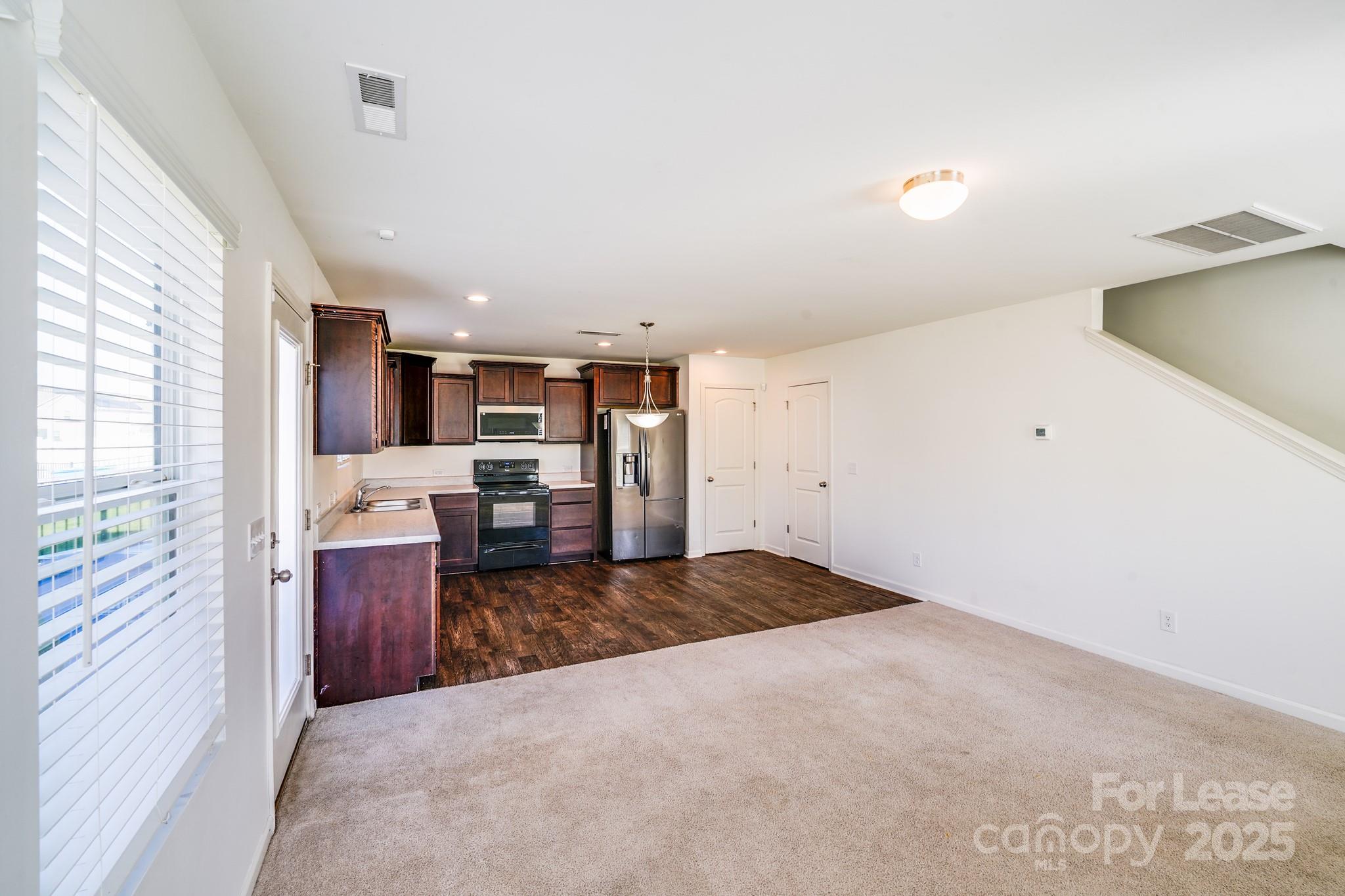 12915 Hill Pine Road Midland, NC 28107 - Photo 11 of 31 a view of kitchen and utility room