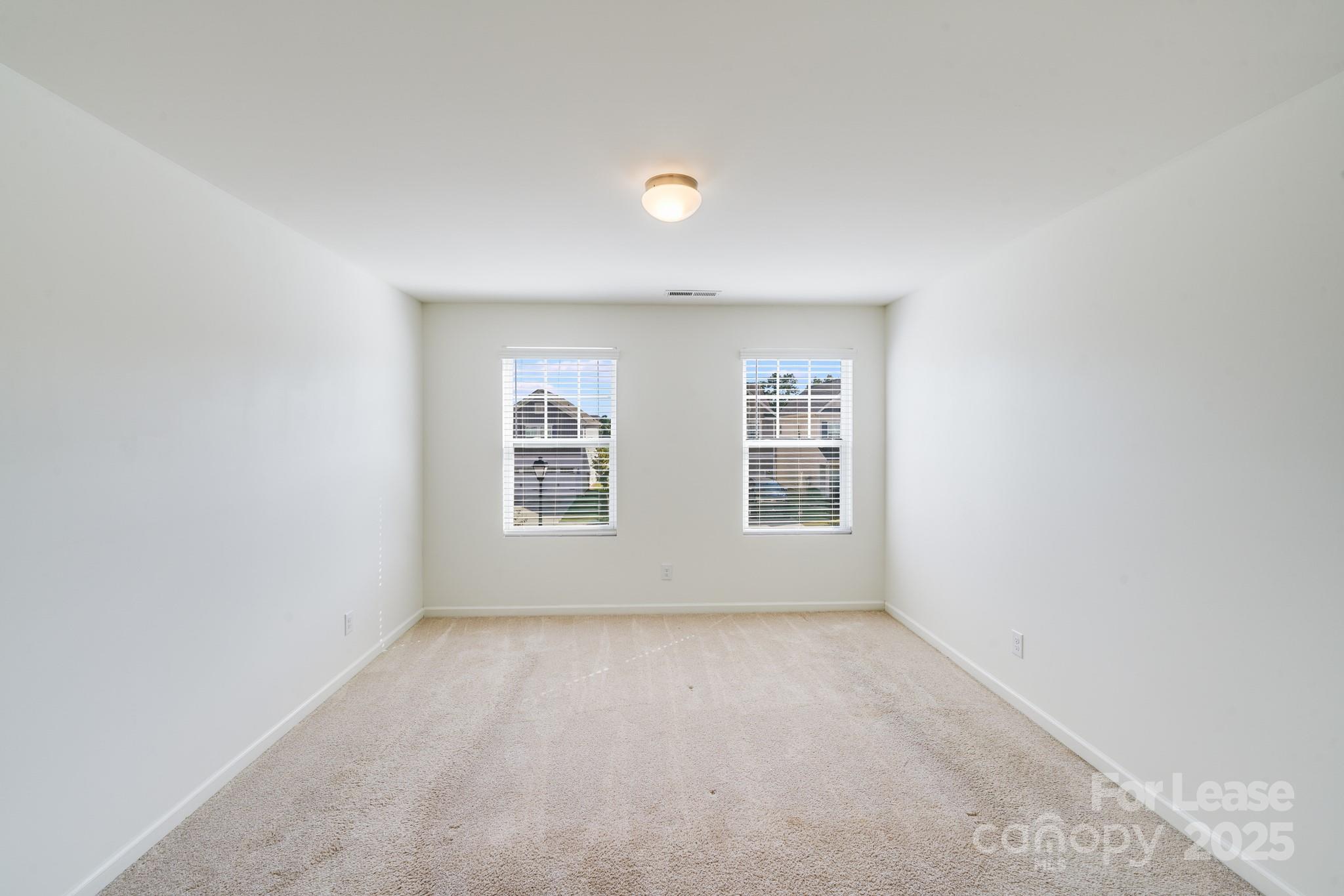 12915 Hill Pine Road Midland, NC 28107 - Photo 18 of 31 an empty room with windows
