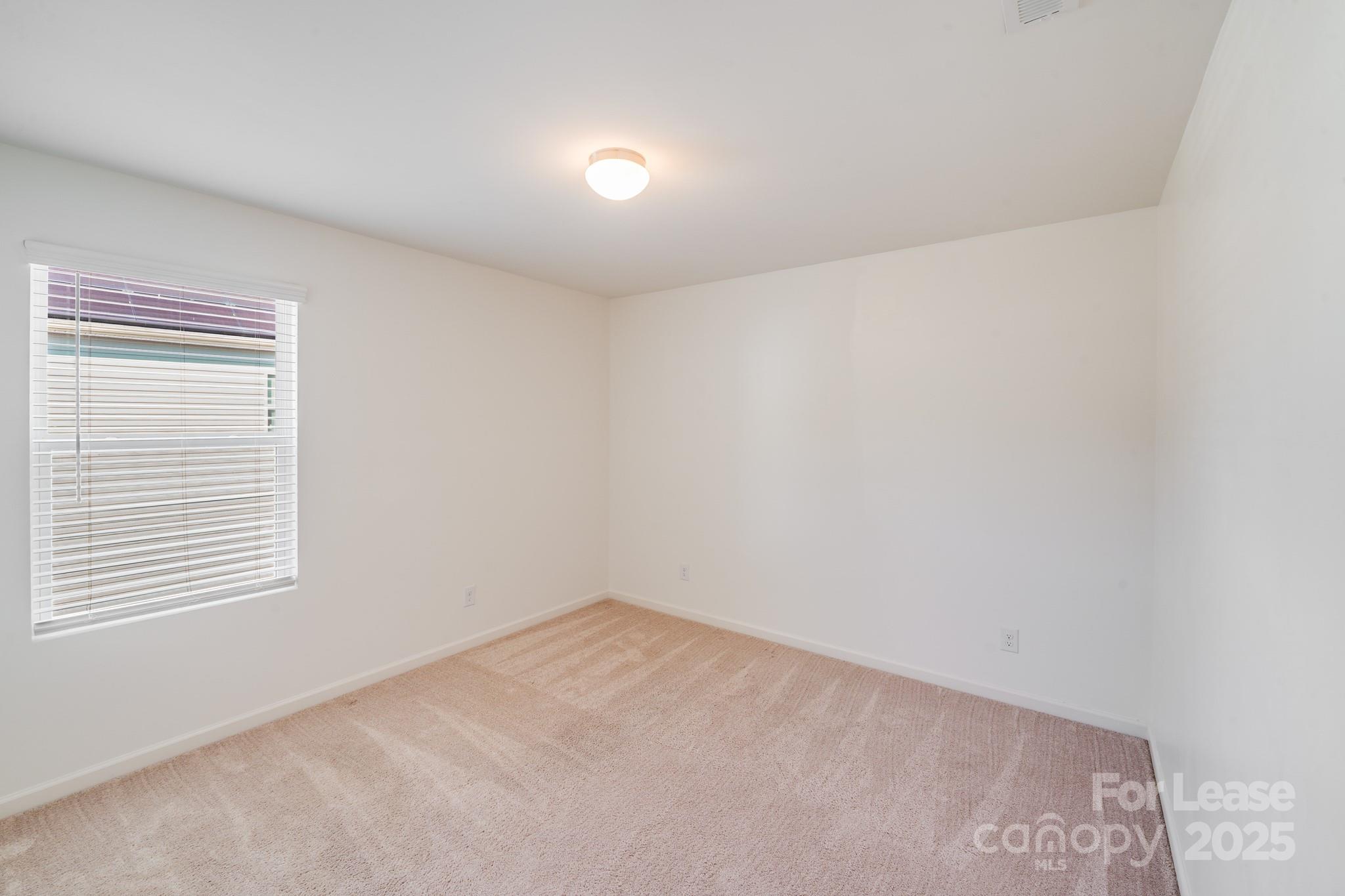 12915 Hill Pine Road Midland, NC 28107 - Photo 21 of 31 an empty room with a window