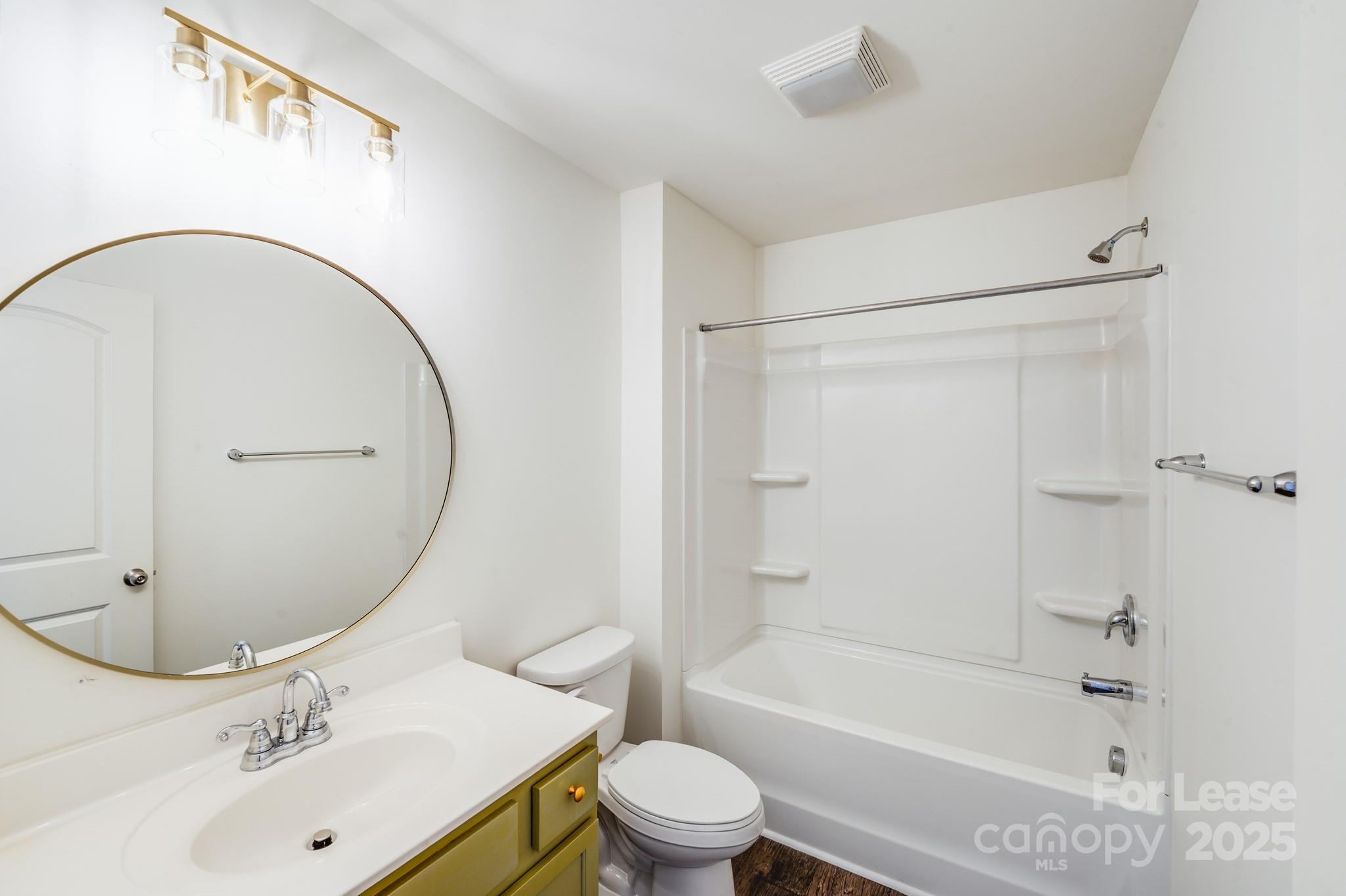 12915 Hill Pine Road Midland, NC 28107 - Photo 26 of 31 a bathroom with a sink toilet and shower