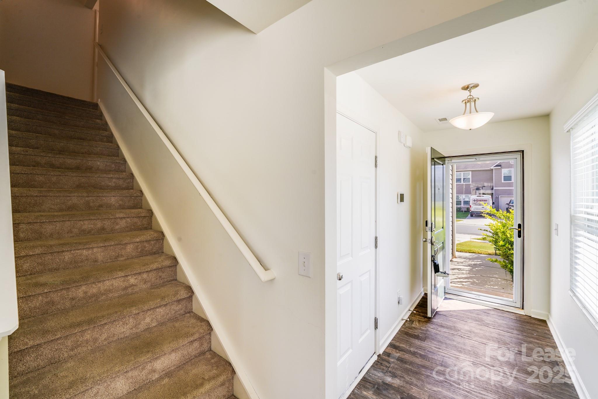 12915 Hill Pine Road Midland, NC 28107 - Photo 9 of 31 a view of a hallway with wooden floor and staircase