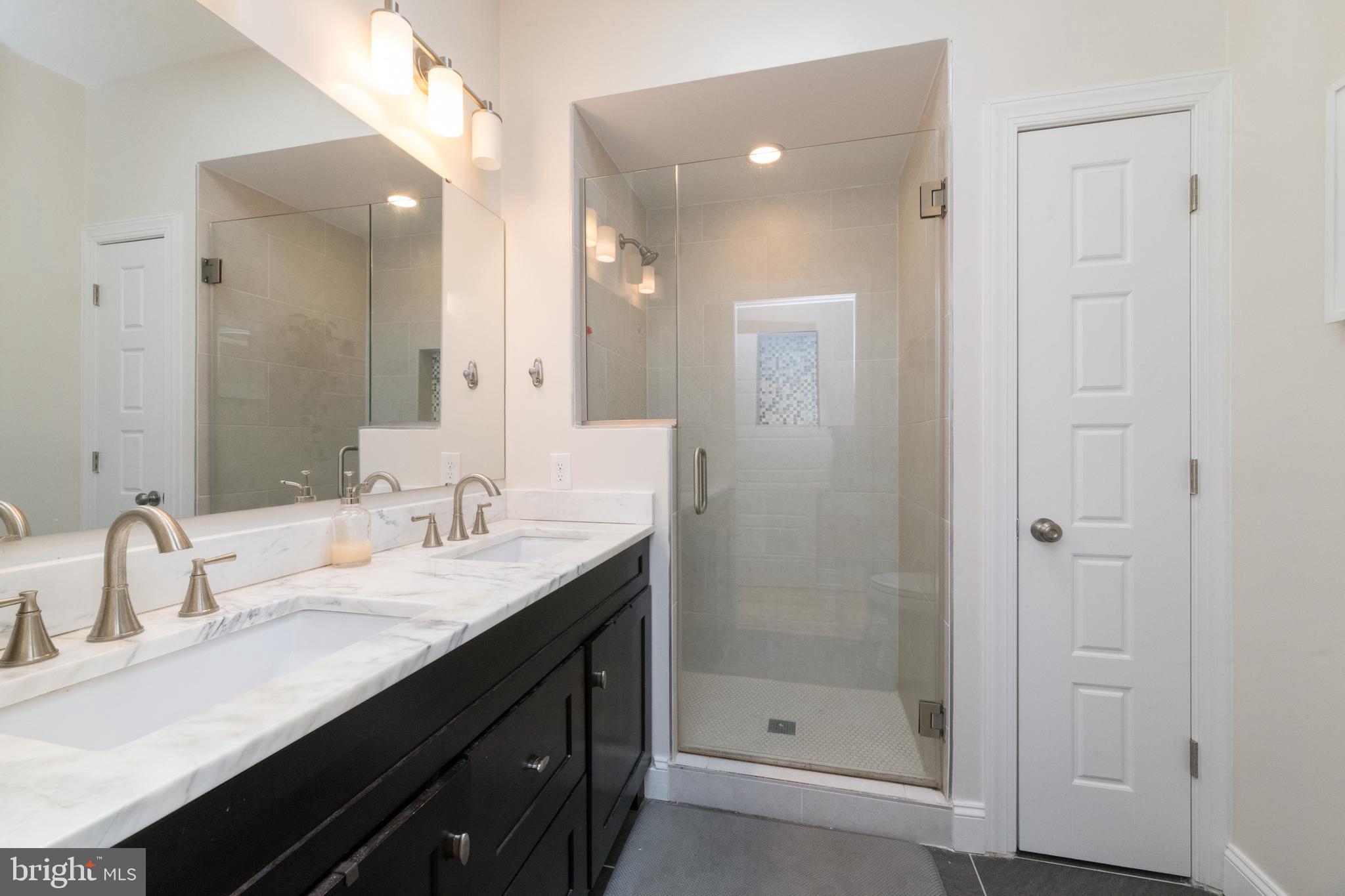 3860 Quarry Avenue Baltimore, MD 21211 - Photo 12 of 31 Master bath with dual sinks & custom tile shower