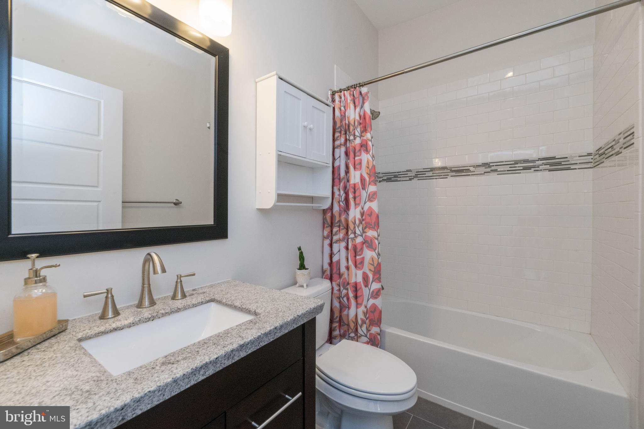 3860 Quarry Avenue Baltimore, MD 21211 - Photo 15 of 31 2nd Bathroom with custom tile & tub/shower