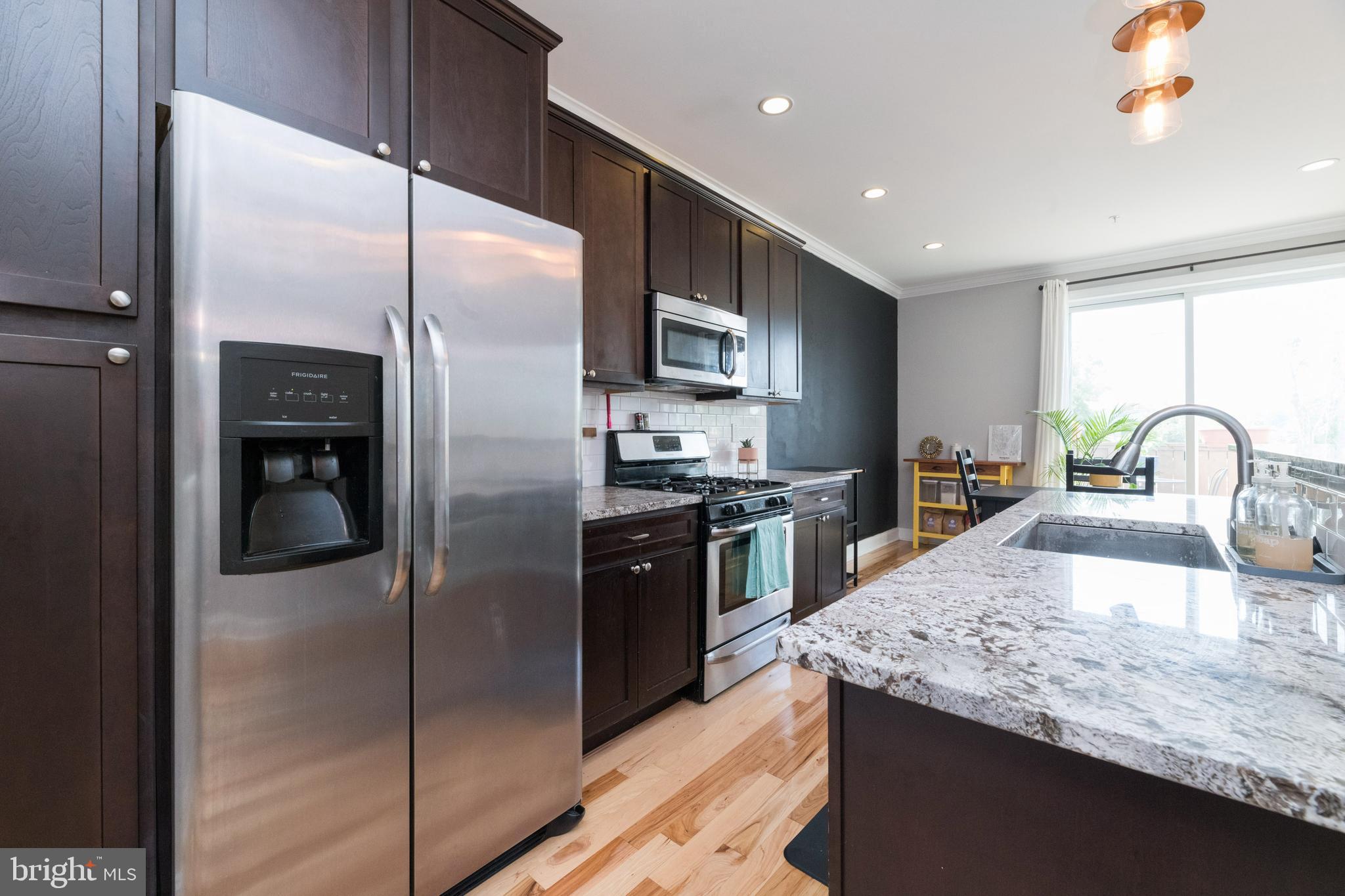3860 Quarry Avenue Baltimore, MD 21211 - Photo 5 of 31 Eat-in kitchen with stainless steel appliances