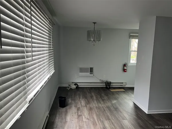 a view of a room with wooden floor and stairs