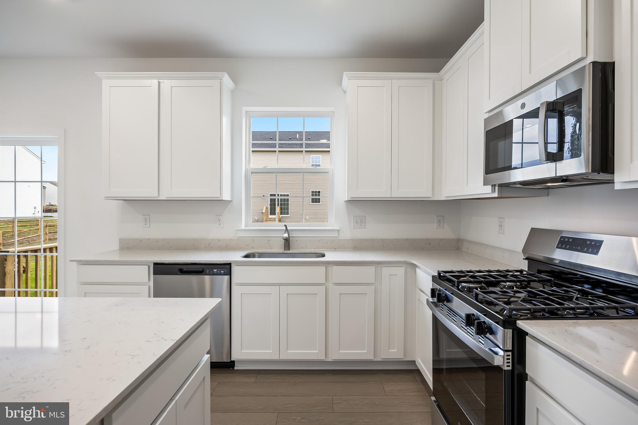 13 Inkwell Lane Sicklerville, NJ 08081 - Photo 14 of 37 a kitchen with stainless steel appliances granite countertop white cabinets and window