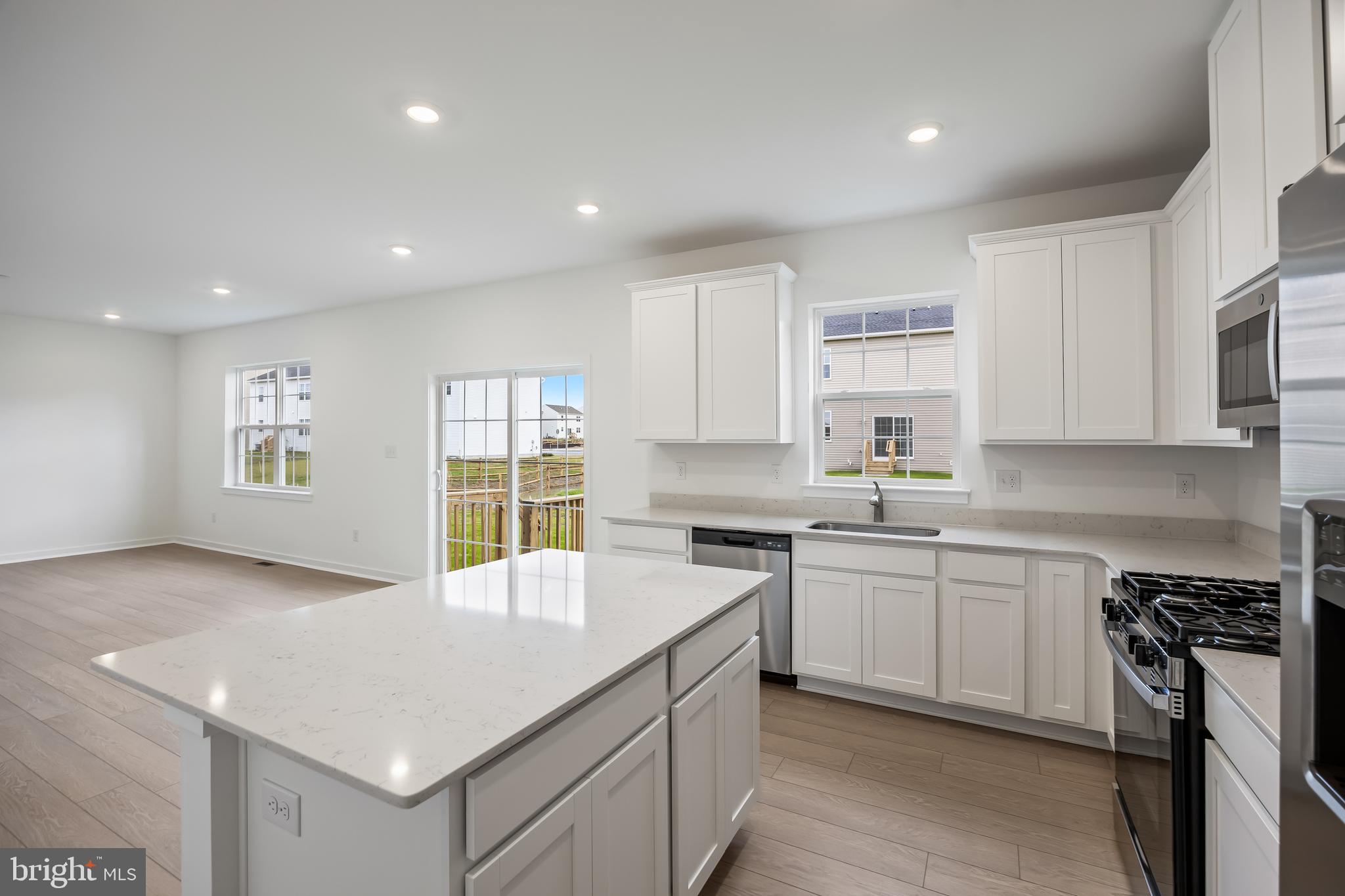 13 Inkwell Lane Sicklerville, NJ 08081 - Photo 15 of 37 a kitchen with a sink stove and cabinets