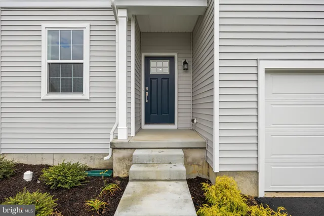 a front view of a house with a garage