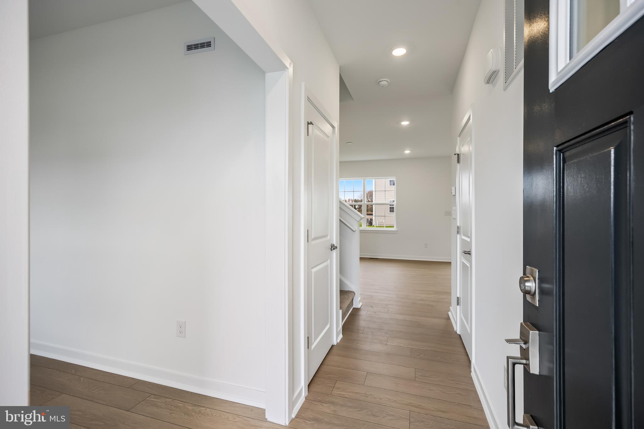 13 Inkwell Lane Sicklerville, NJ 08081 - Photo 4 of 37 a view of a hallway with wooden floor