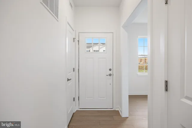 a view of an entryway with hallway