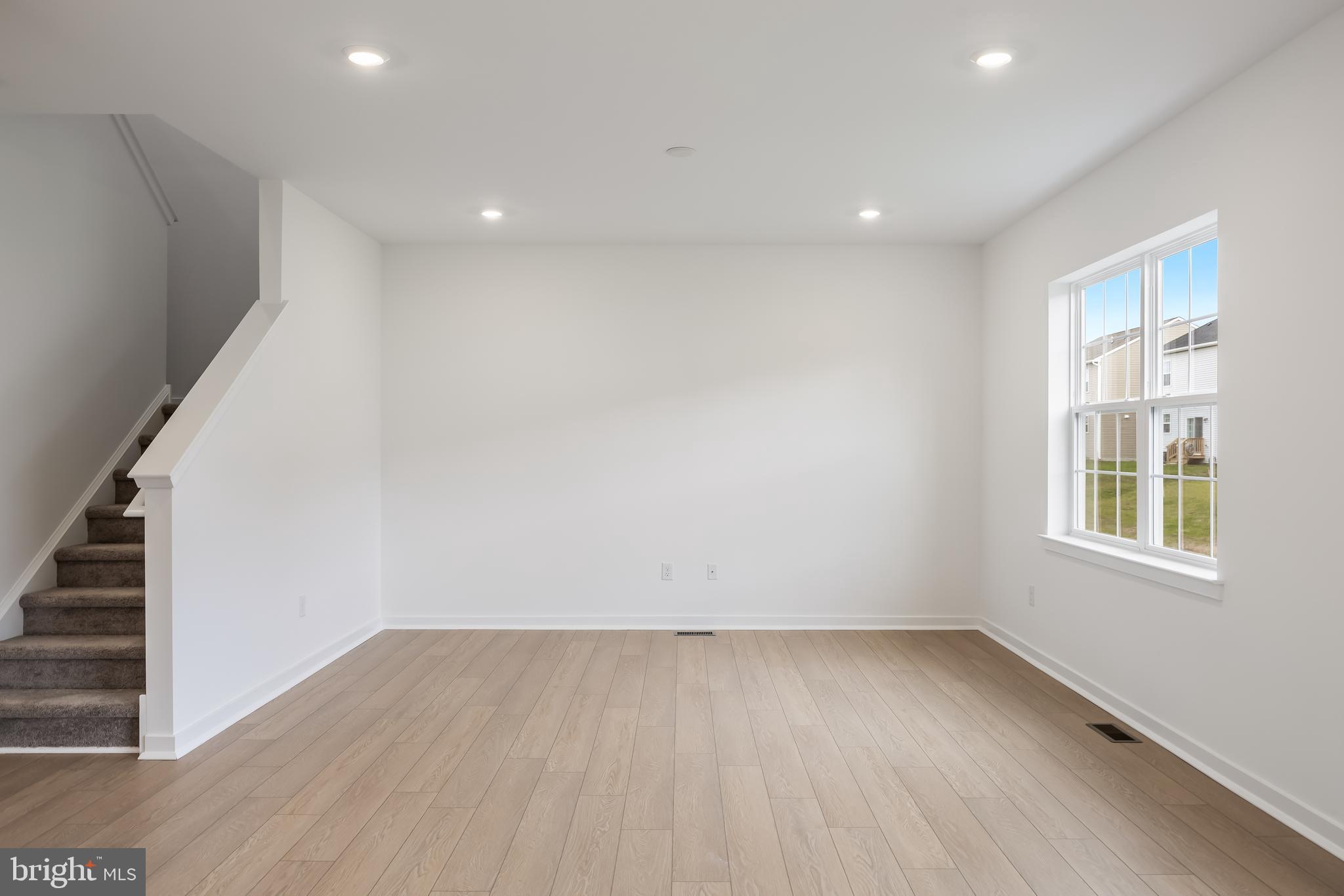 13 Inkwell Lane Sicklerville, NJ 08081 - Photo 8 of 37 an empty room with wooden floor and windows